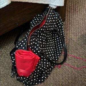 Kate Spade Black and White Polka Dot Bag
It measures 18 in long12 in tall 10in w